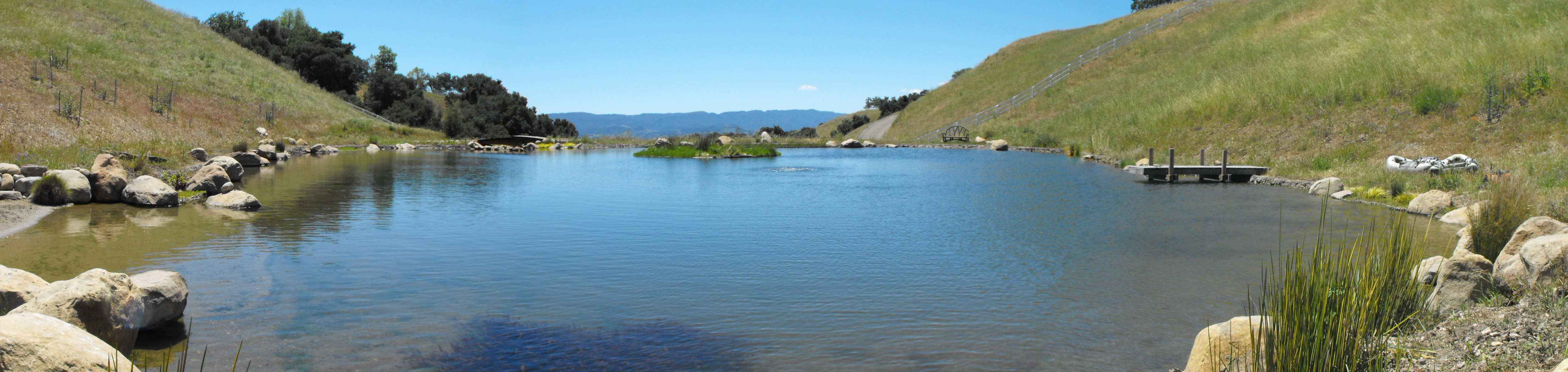 Santa Ynez mini lake complete with a beach entry, a dock and a floating island!