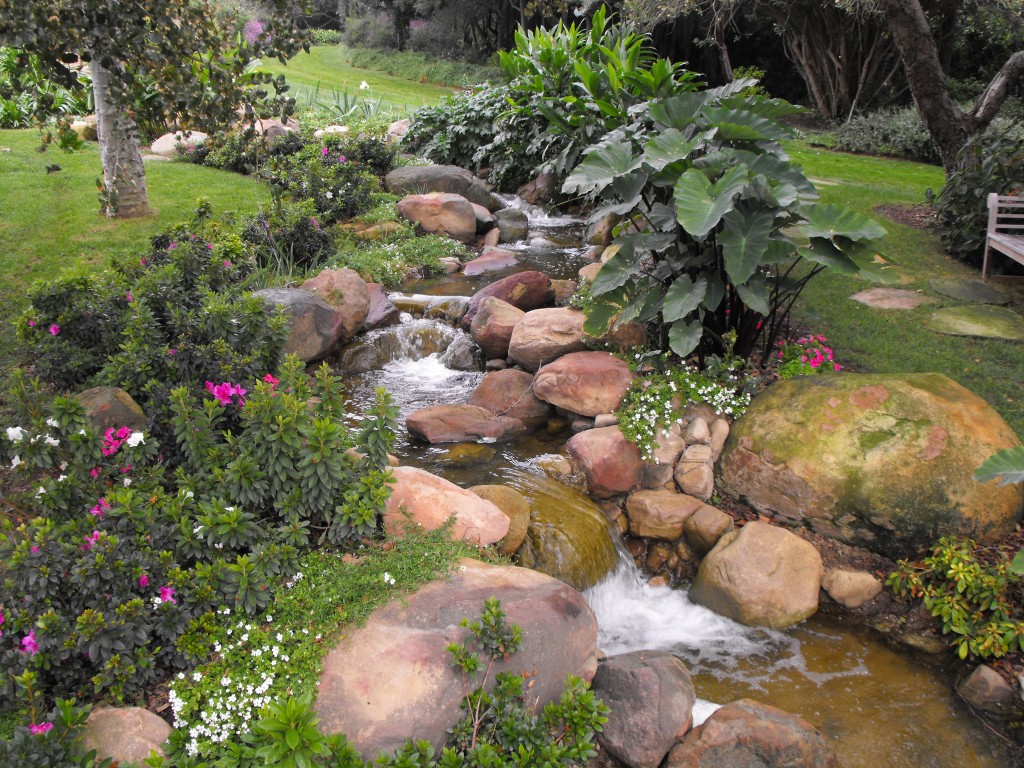 "Rock and flowing water in the garden"
