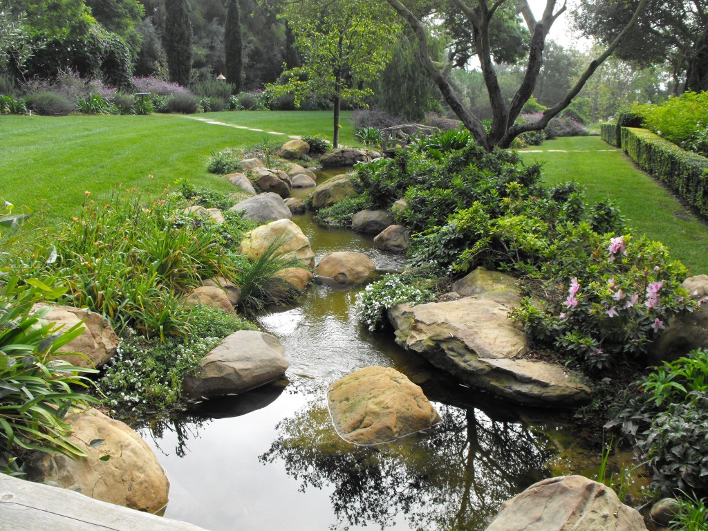 "Rock and water flowing through the garden"